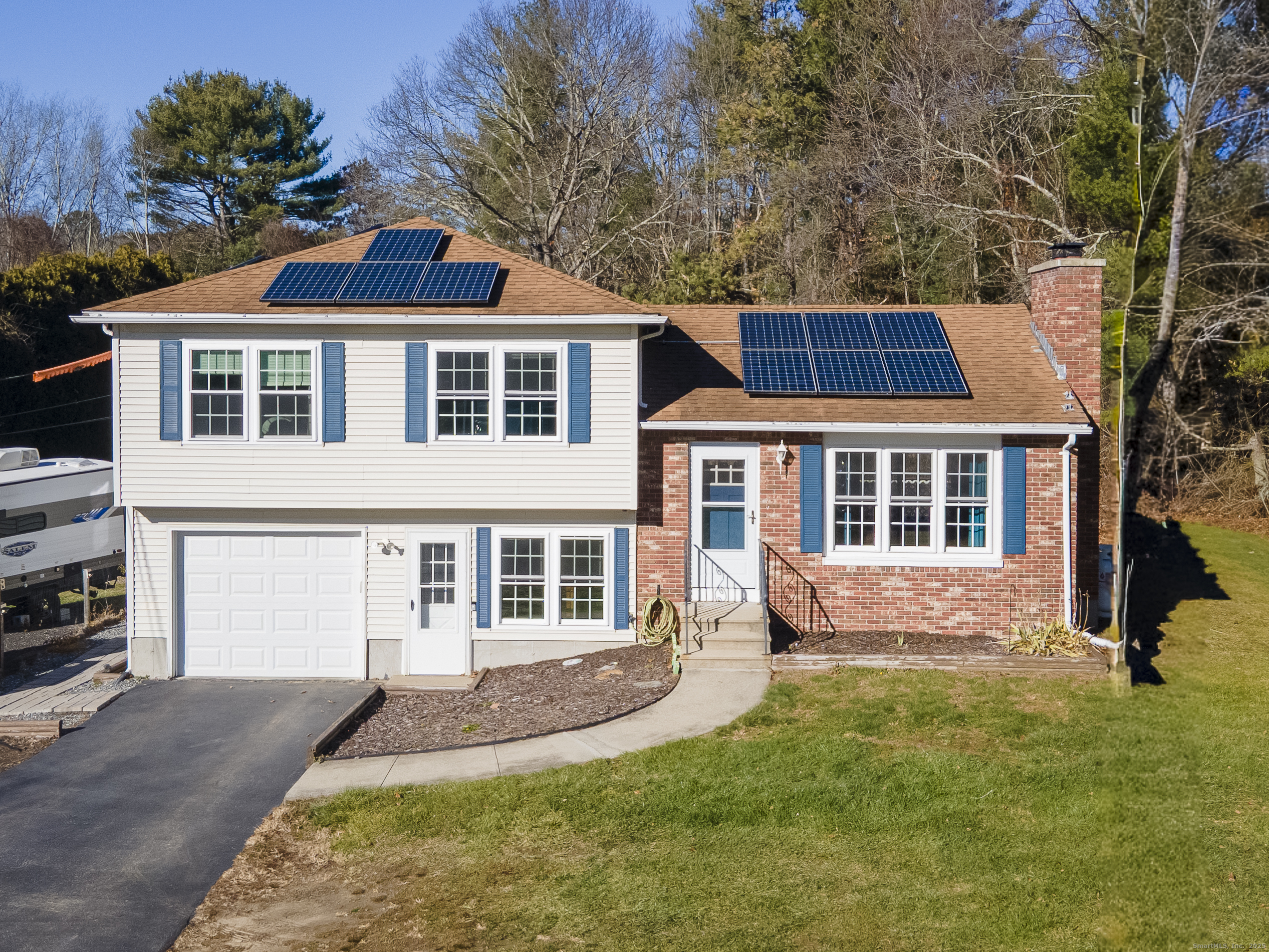 a front view of a house with a yard