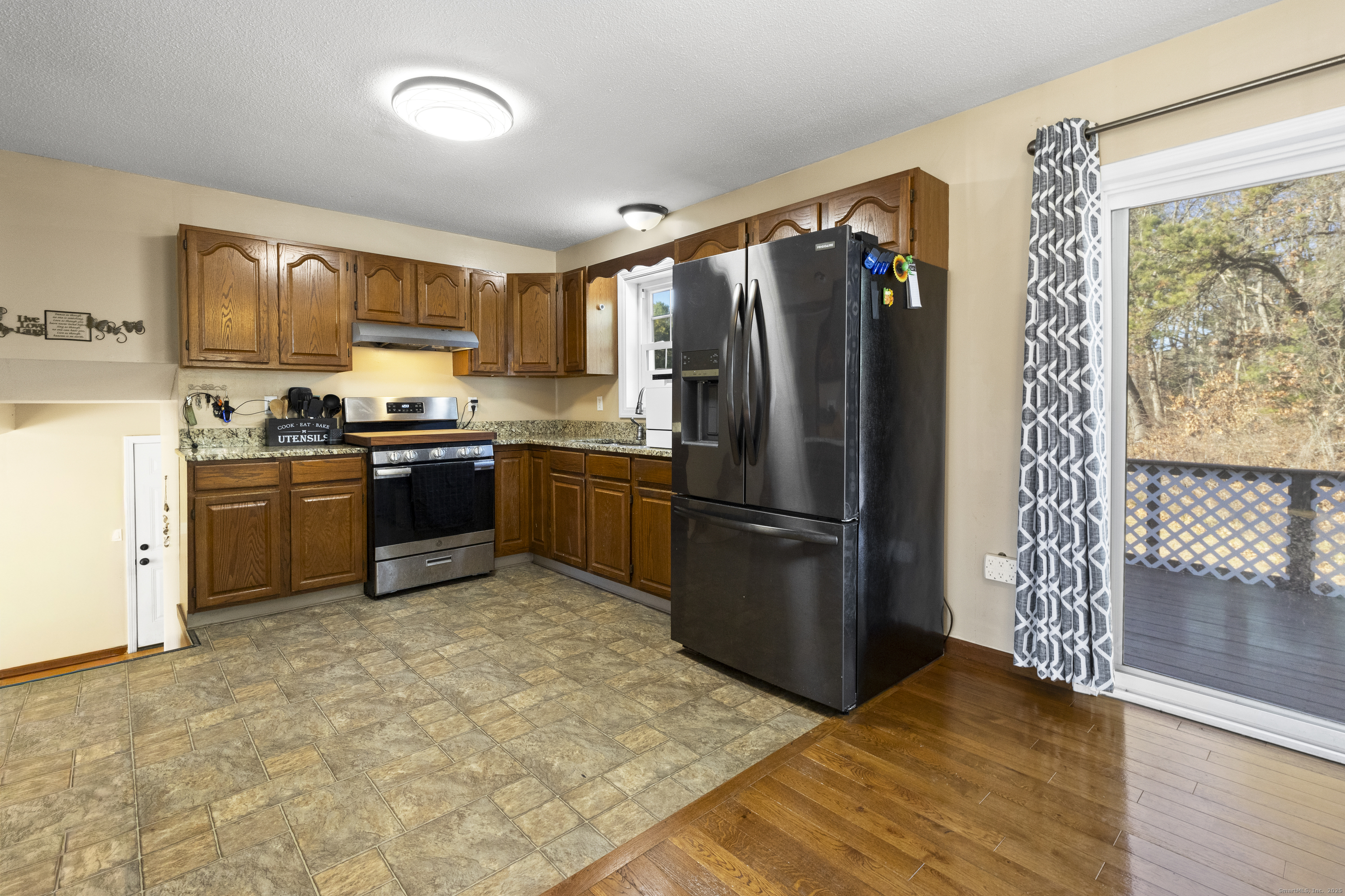 230 Cemetery Road Plainfield, CT 06374 - Photo 11 of 29 a kitchen with stainless steel appliances granite countertop a refrigerator stove and sink