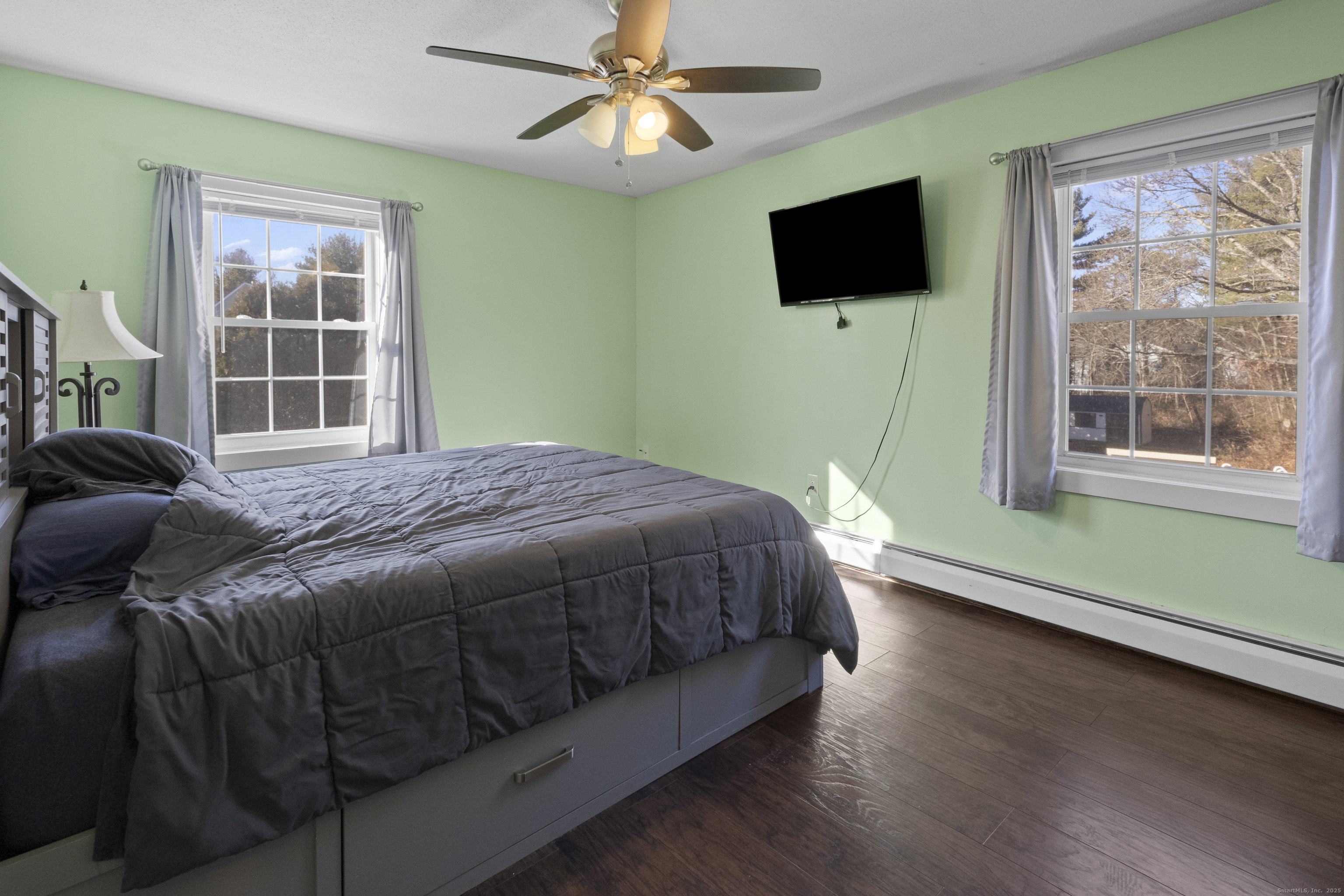 230 Cemetery Road Plainfield, CT 06374 - Photo 15 of 29 a bedroom with a bed and a flat screen tv