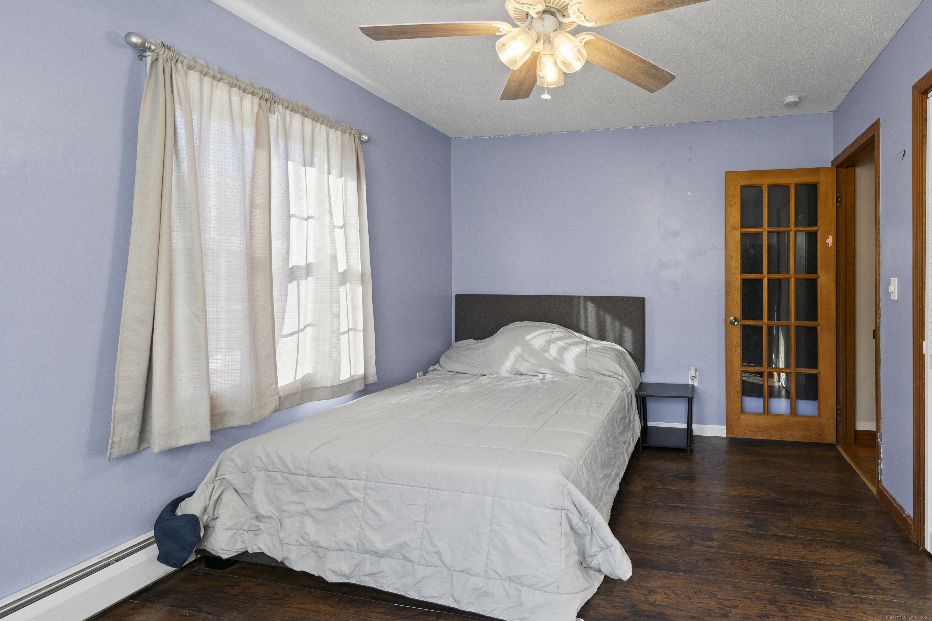 230 Cemetery Road Plainfield, CT 06374 - Photo 17 of 29 a bed sitting in a bedroom next to a window