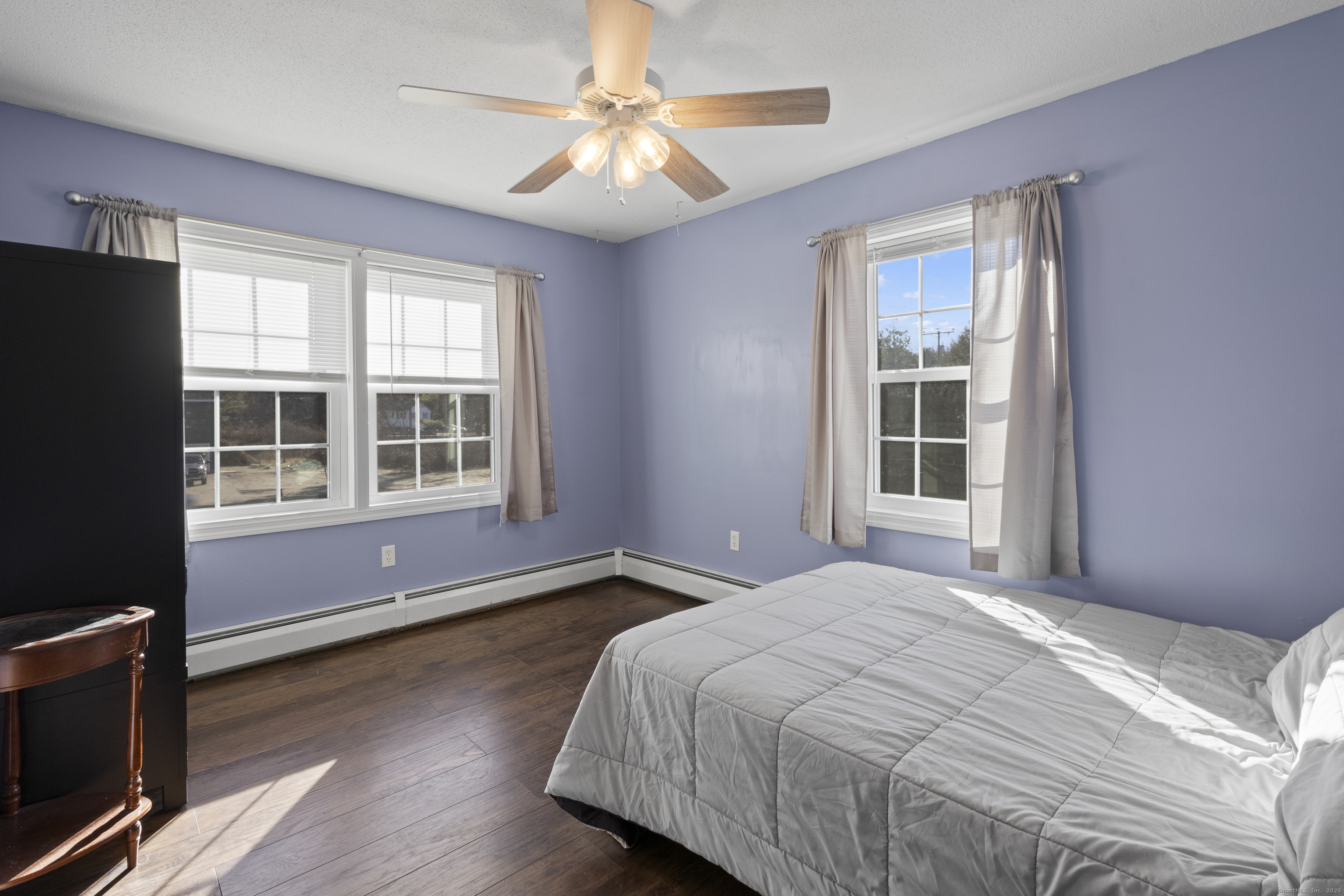 230 Cemetery Road Plainfield, CT 06374 - Photo 18 of 29 a bedroom with a bed and wooden floor