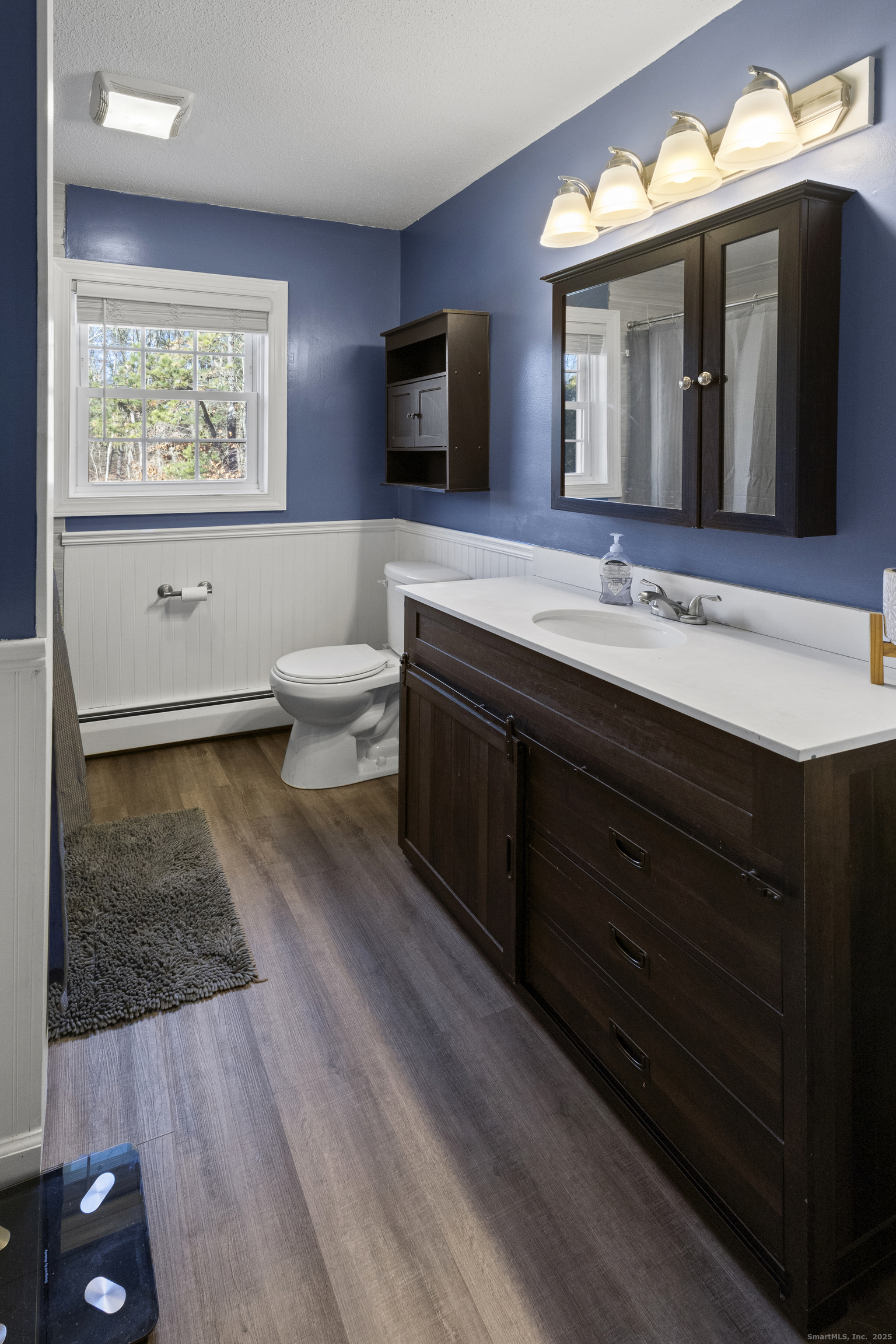 230 Cemetery Road Plainfield, CT 06374 - Photo 20 of 29 a bathroom with a toilet sink double vanity granite and mirror
