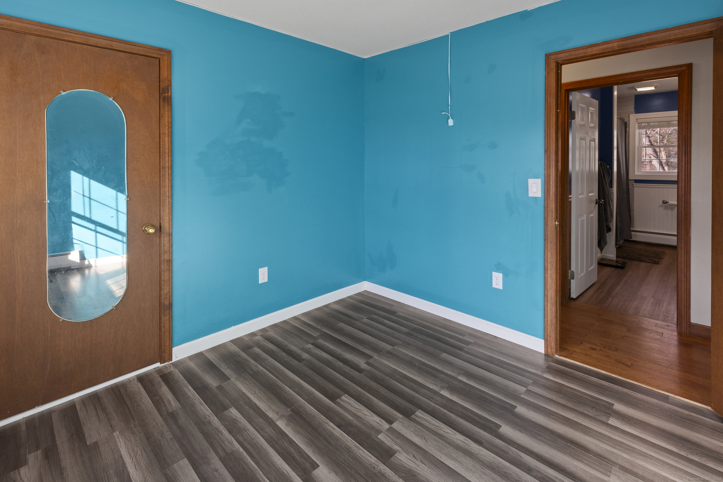 230 Cemetery Road Plainfield, CT 06374 - Photo 21 of 29 a view of a hallway with wooden floor and a window