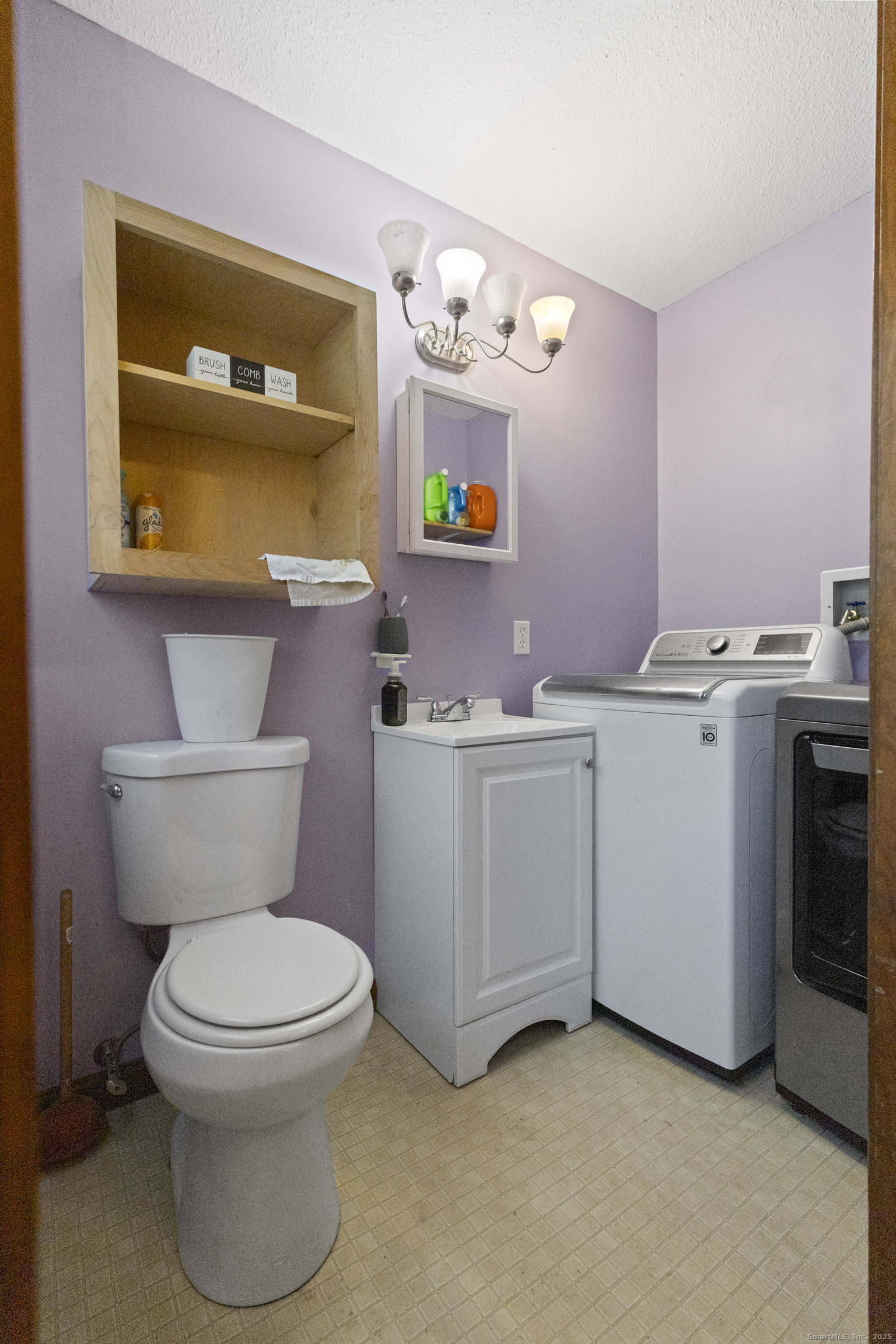 230 Cemetery Road Plainfield, CT 06374 - Photo 24 of 29 a bathroom with a toilet a sink and a mirror