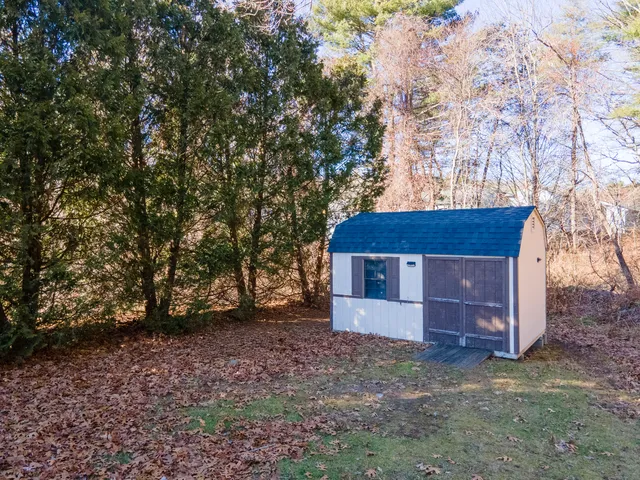 a house that has a tree in front of it