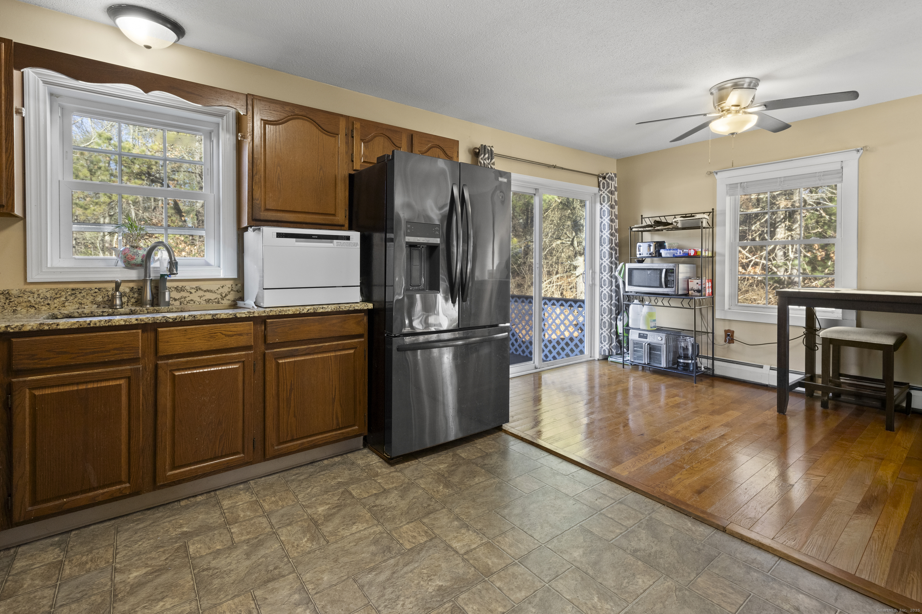 230 Cemetery Road Plainfield, CT 06374 - Photo 7 of 29 a kitchen with stainless steel appliances granite countertop a refrigerator a stove and a sink with granite countertops