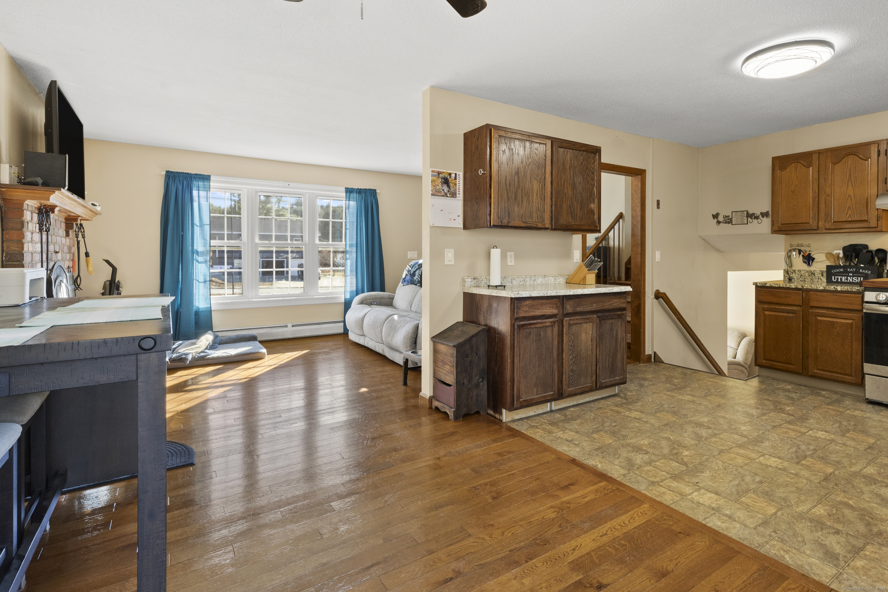 230 Cemetery Road Plainfield, CT 06374 - Photo 10 of 29 a living room with furniture and a flat screen tv