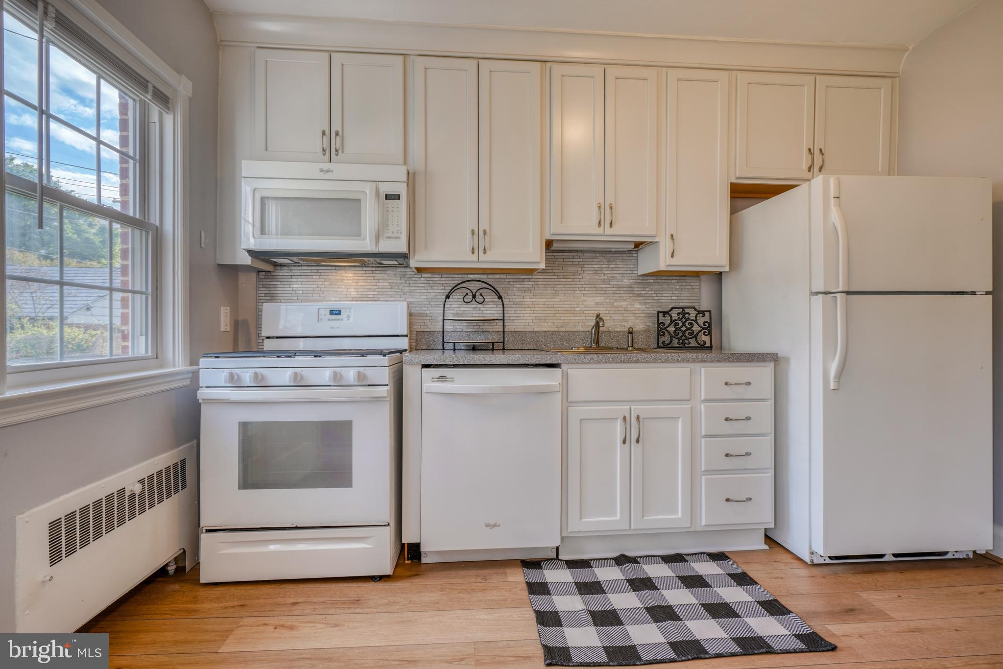 217 Dumbarton Road Baltimore, MD 21212 - Photo 8 of 33 Kitchen w/New Flooring- 2023