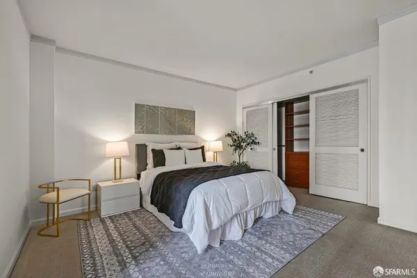 a bedroom with a bed and closet