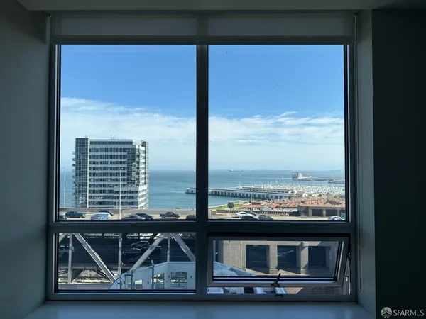a view of wooden floor with a view of barbeque grill