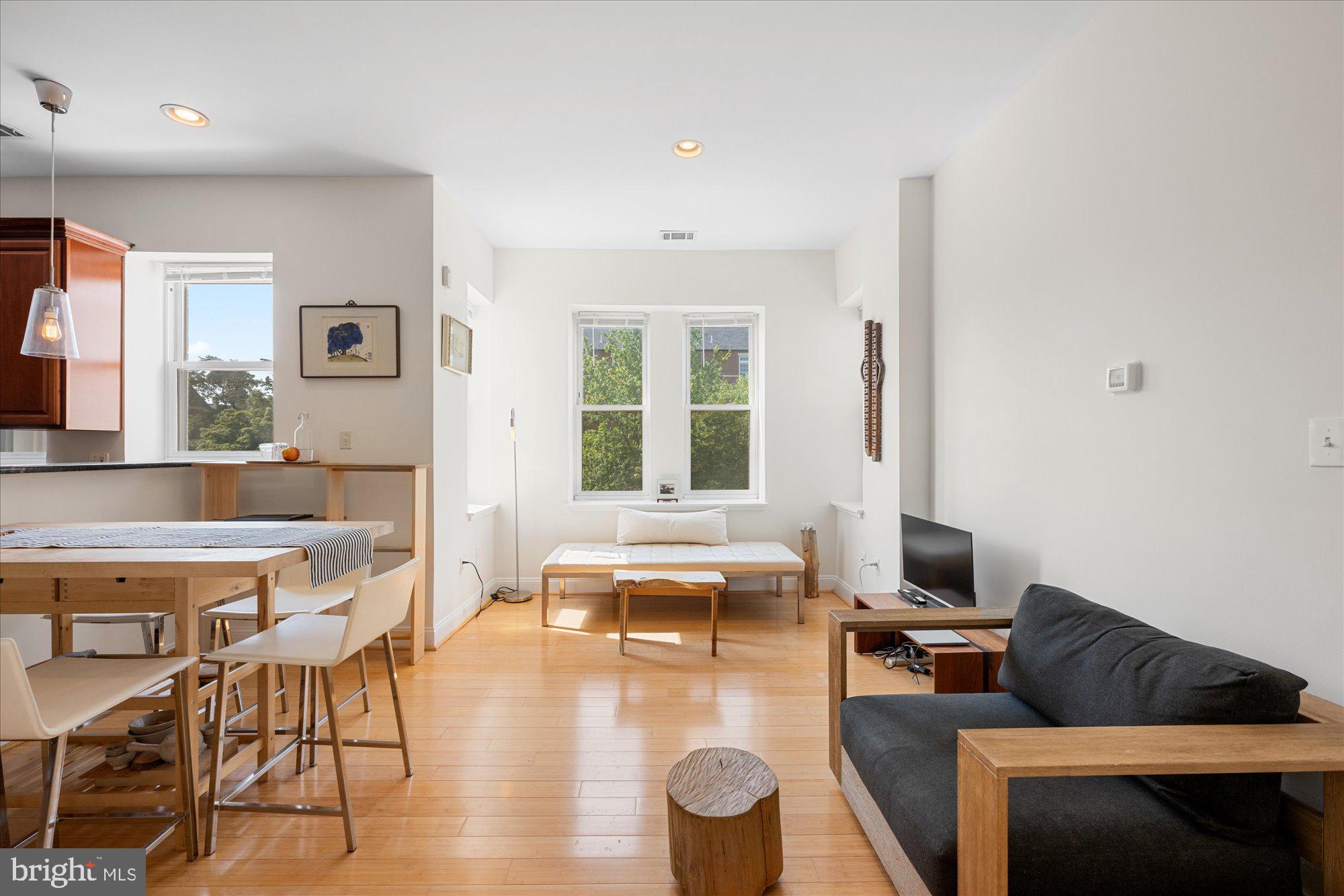 1124 E Street Northeast, Unit A Washington, DC 20002 - Photo 4 of 10 a living room with furniture and a window