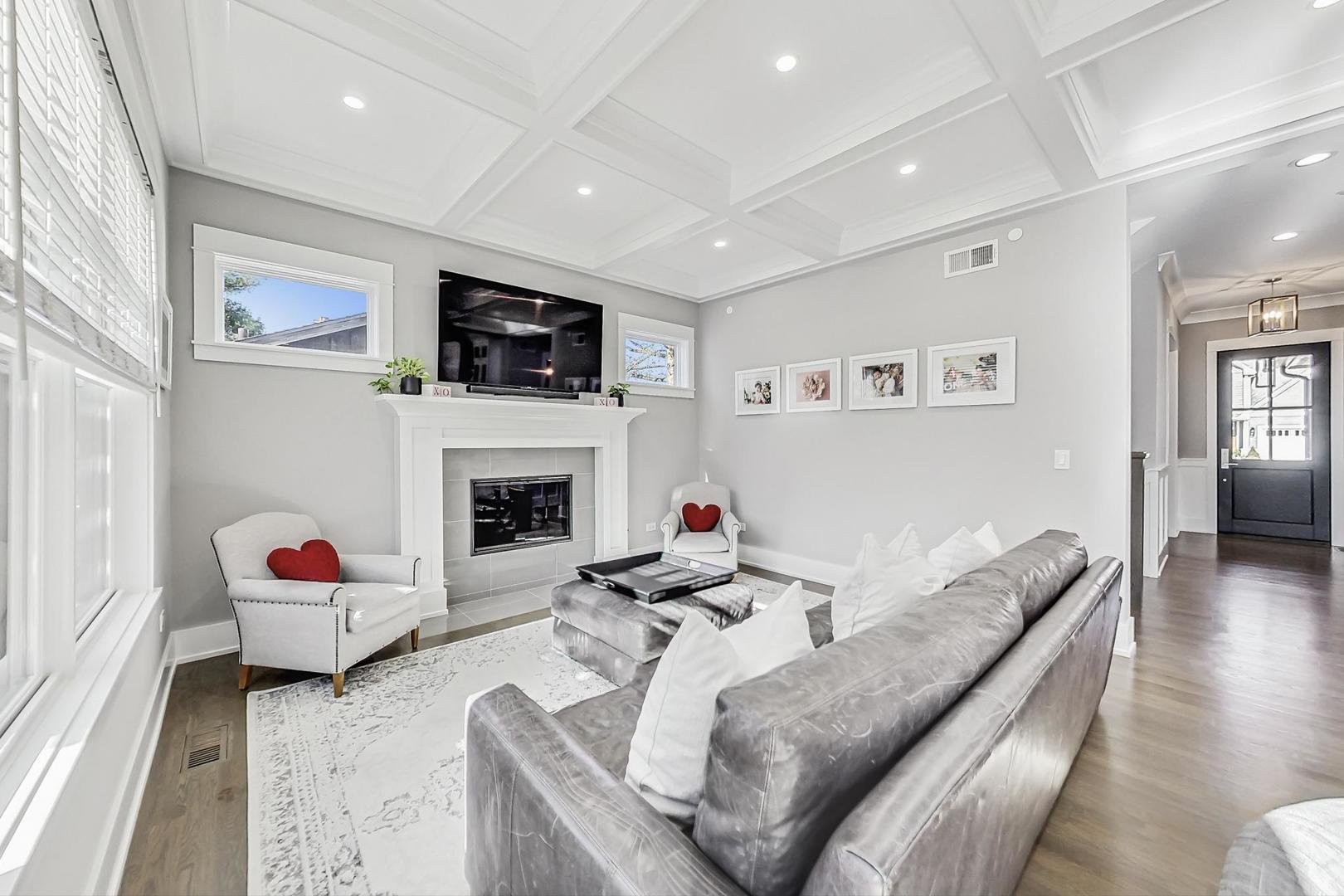 2425 Illinois Road Northbrook, IL 60062 - Photo 14 of 59 a living room with furniture fireplace and a flat screen tv
