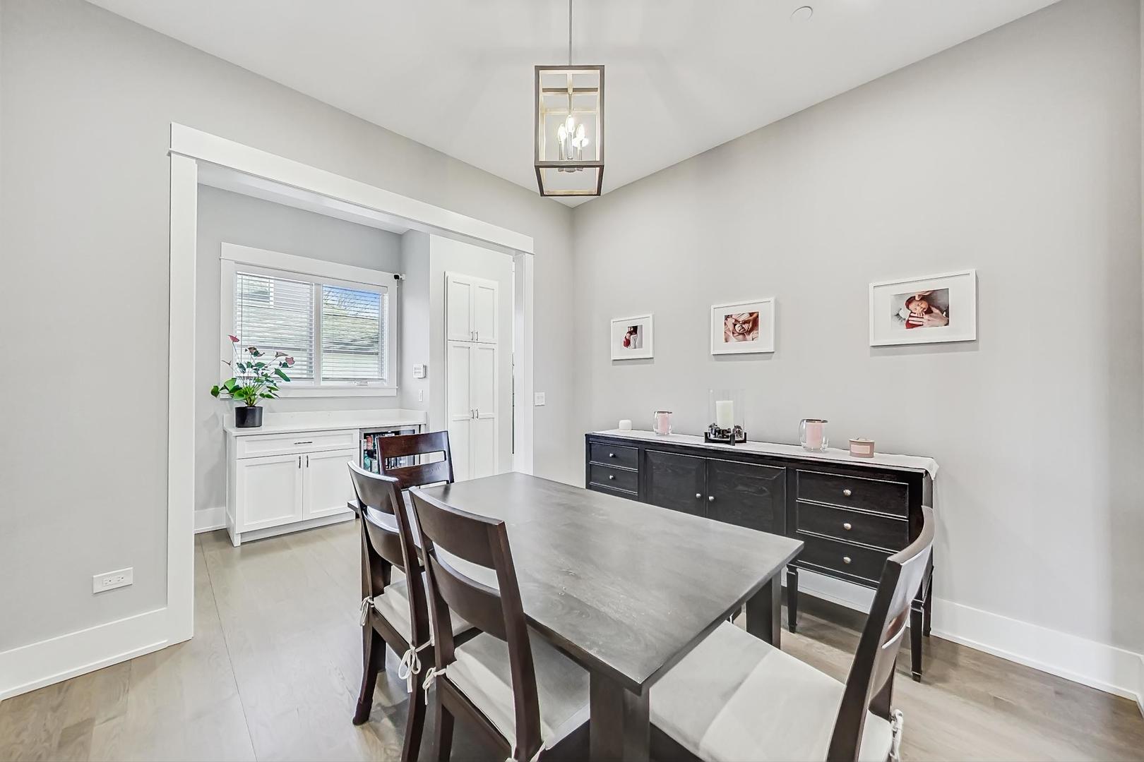 2425 Illinois Road Northbrook, IL 60062 - Photo 17 of 59 a view of a dining room with furniture and wooden floor