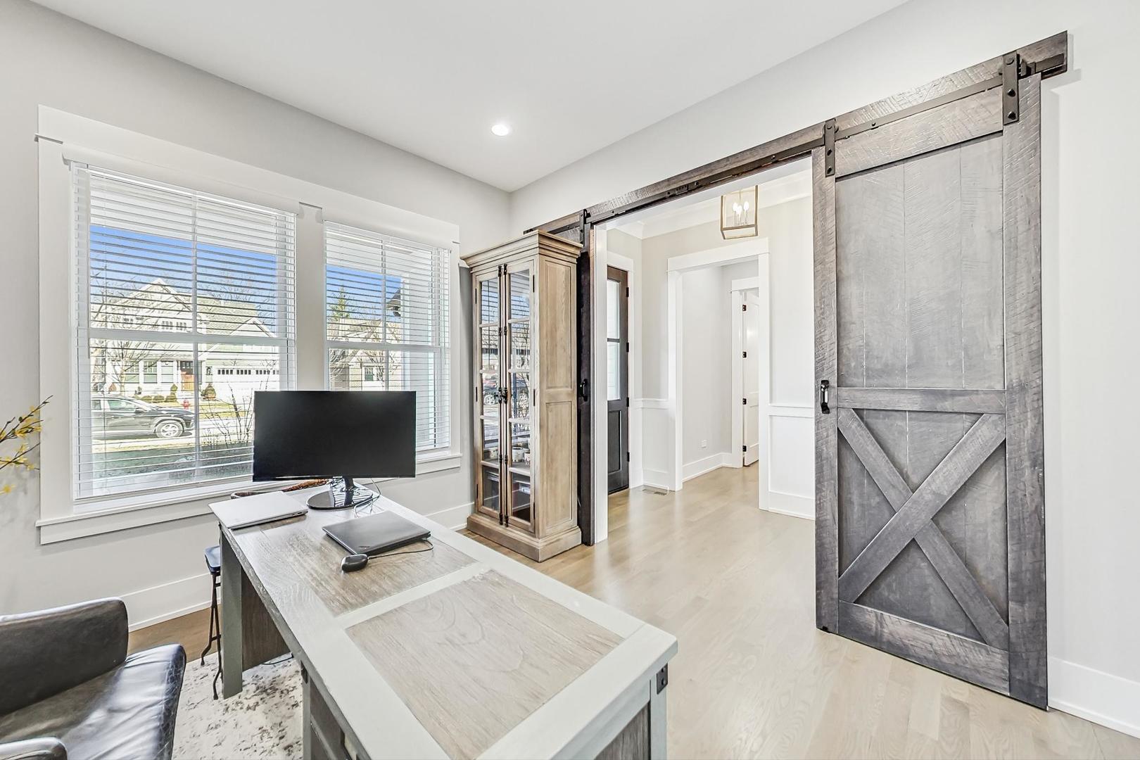 2425 Illinois Road Northbrook, IL 60062 - Photo 18 of 59 a living room with furniture and a flat screen tv
