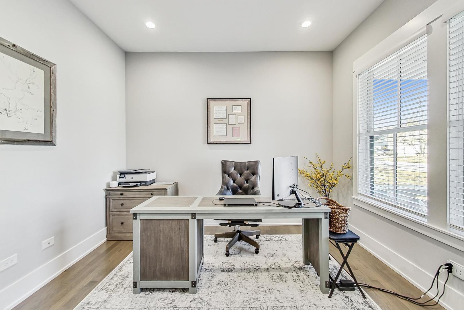 2425 Illinois Road Northbrook, IL 60062 - Photo 19 of 59 a view of a workspace with furniture and a window