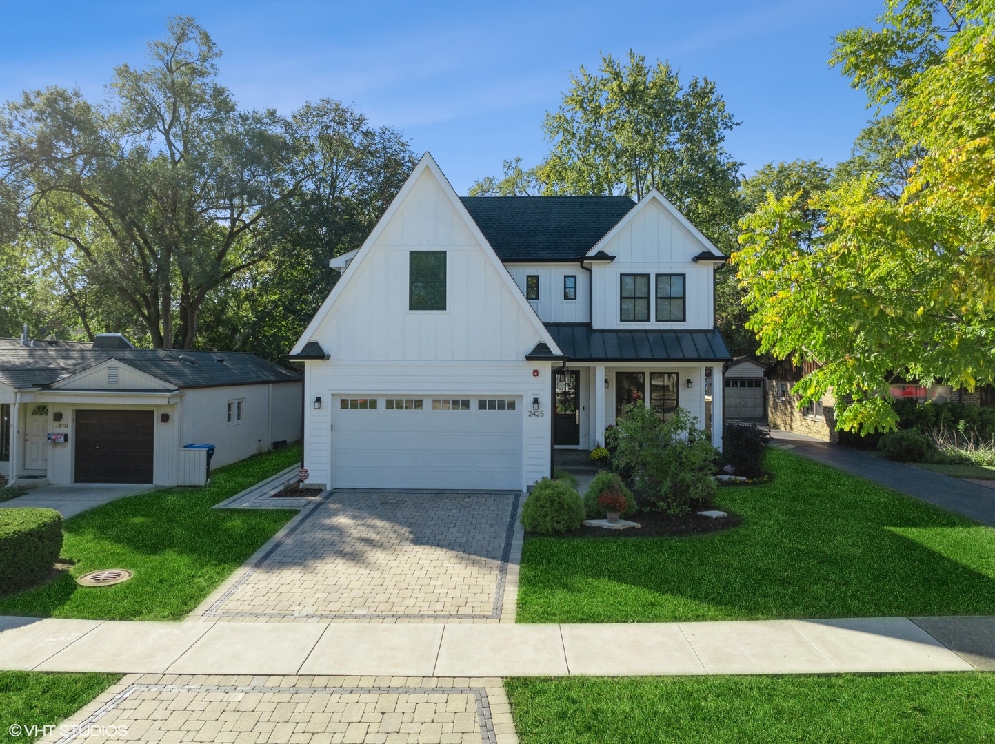 2425 Illinois Road Northbrook, IL 60062 - Photo 2 of 59 a front view of a house with a yard and trees