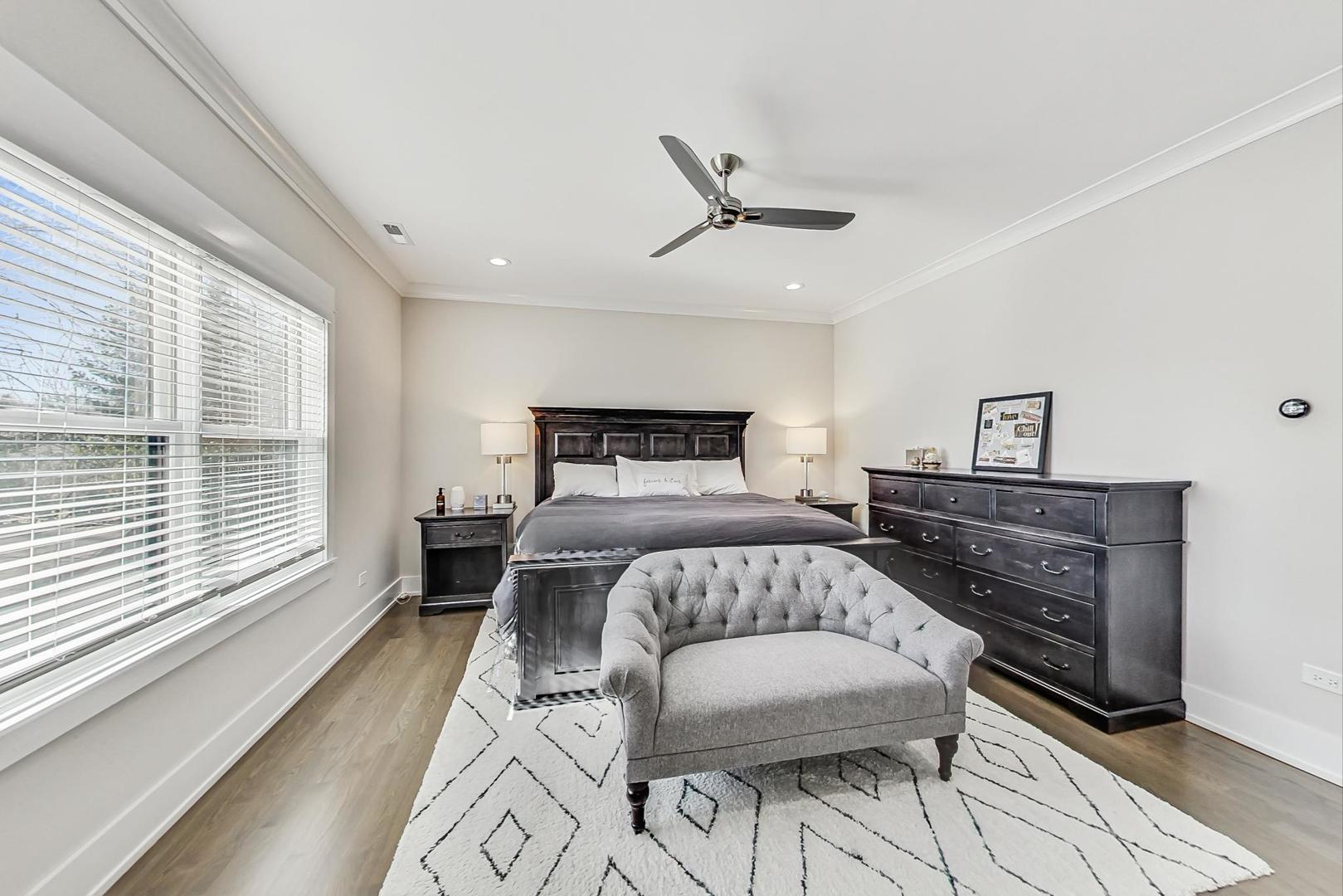 2425 Illinois Road Northbrook, IL 60062 - Photo 25 of 59 a bedroom with a bed and wooden floor