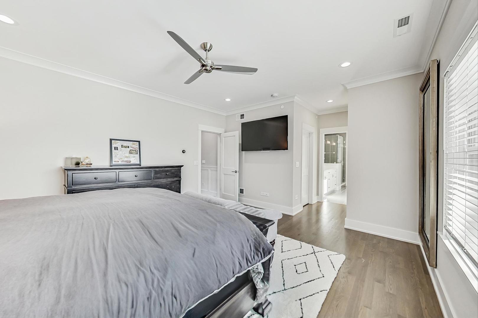 2425 Illinois Road Northbrook, IL 60062 - Photo 26 of 59 a bed room with a bed and a television