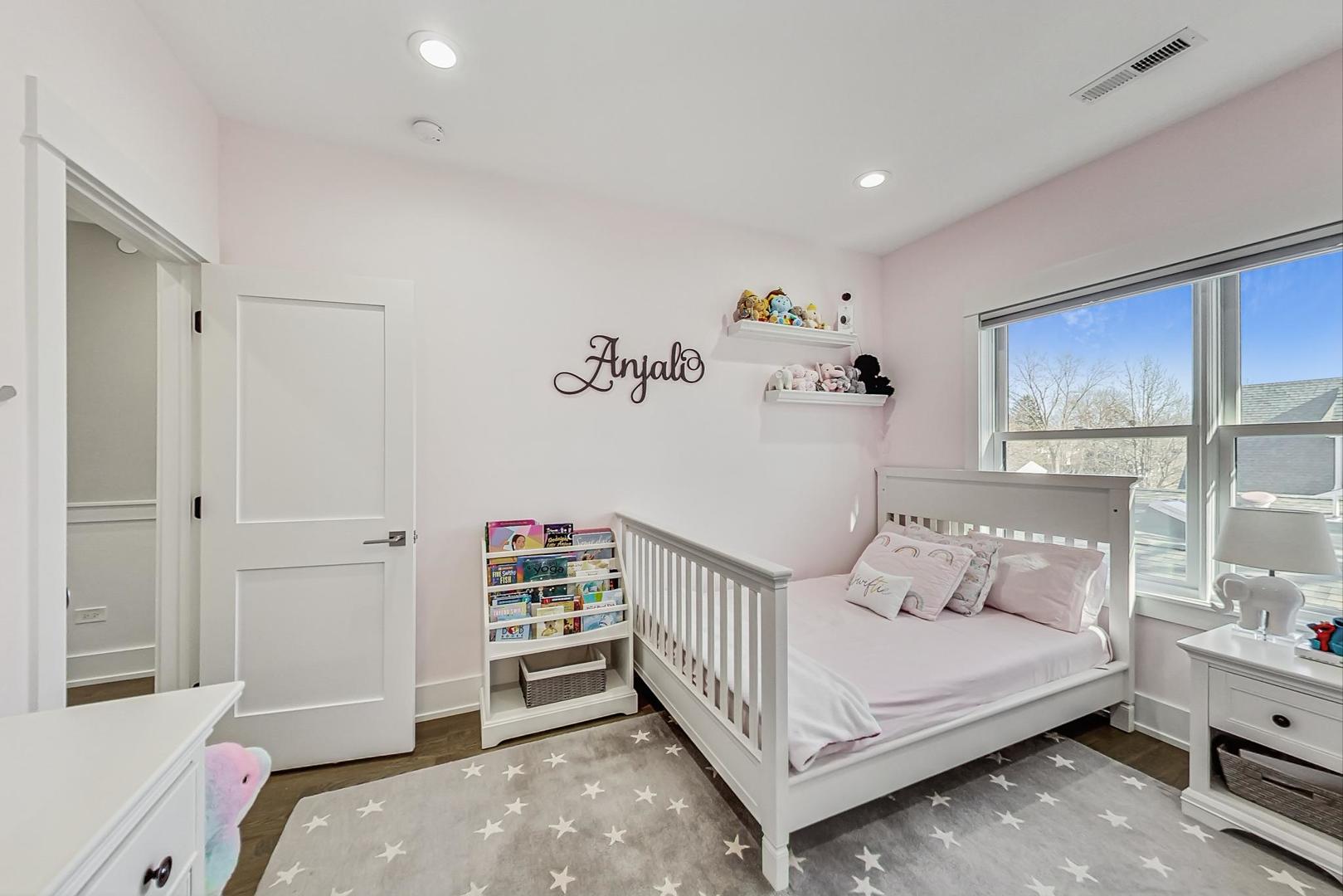 2425 Illinois Road Northbrook, IL 60062 - Photo 29 of 59 a bedroom with a bed and a window