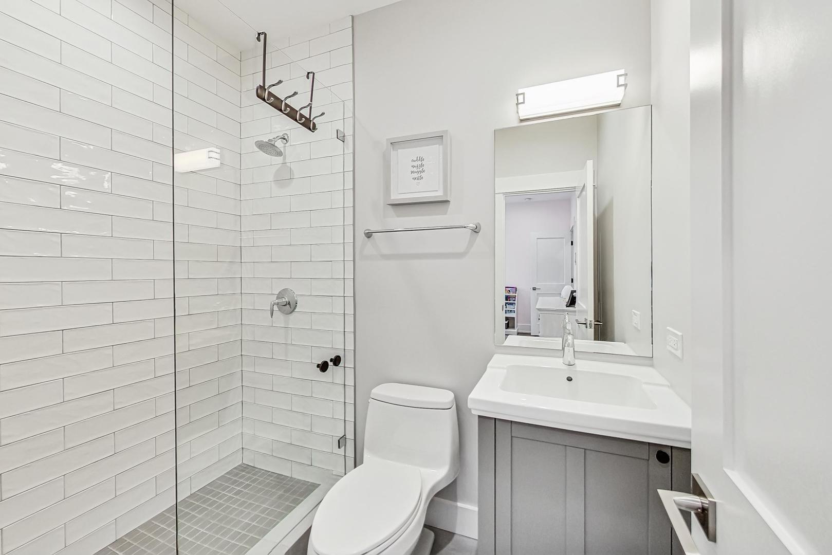 2425 Illinois Road Northbrook, IL 60062 - Photo 31 of 59 a bathroom with a sink toilet and shower