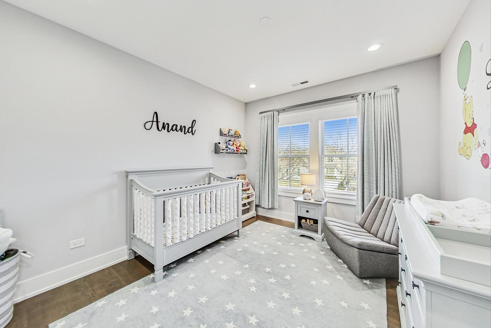 2425 Illinois Road Northbrook, IL 60062 - Photo 32 of 59 a bedroom with furniture and a large window