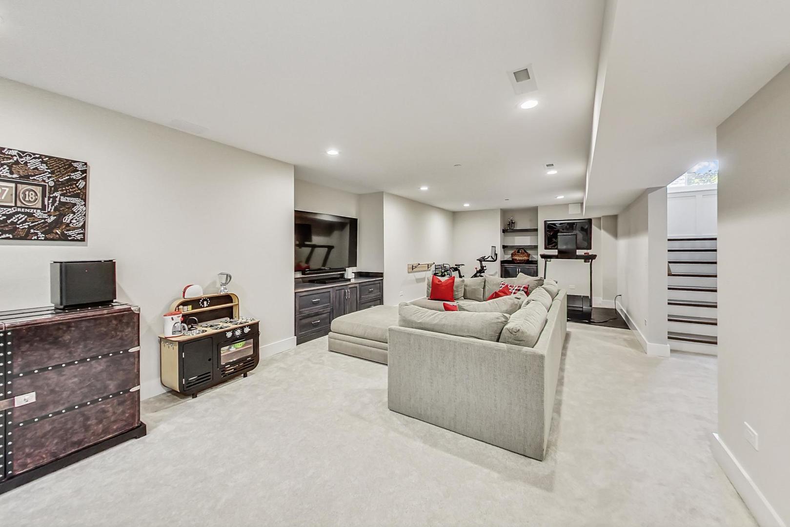 2425 Illinois Road Northbrook, IL 60062 - Photo 39 of 59 a living room with furniture and a flat screen tv