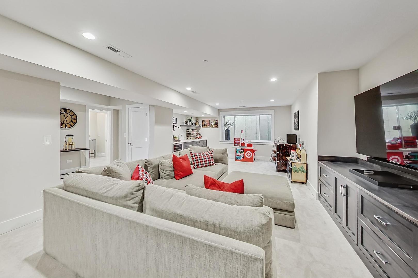 2425 Illinois Road Northbrook, IL 60062 - Photo 40 of 59 a living room with furniture and a flat screen tv