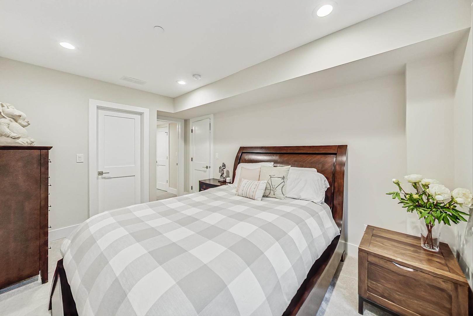 2425 Illinois Road Northbrook, IL 60062 - Photo 42 of 59 a bedroom with a bed and a potted plant