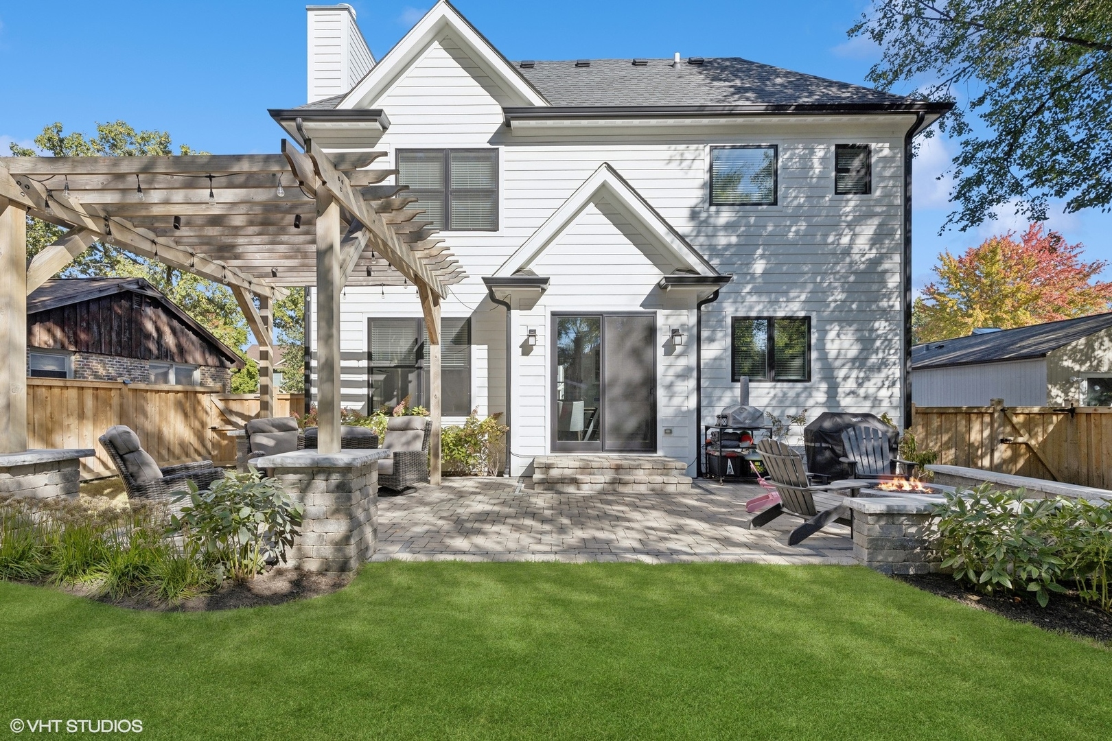 2425 Illinois Road Northbrook, IL 60062 - Photo 49 of 59 a view of a house with a garden and patio