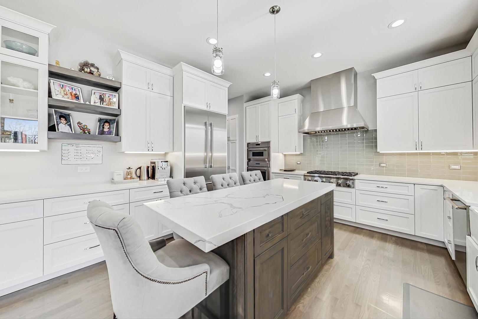 2425 Illinois Road Northbrook, IL 60062 - Photo 10 of 59 a kitchen with white cabinets and white appliances