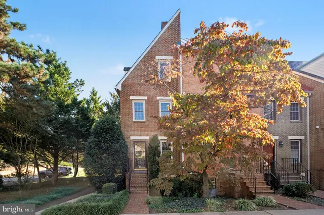 front view of a house with a tree