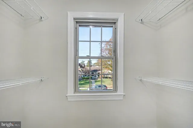 a bathroom with a white toilet sink and shower