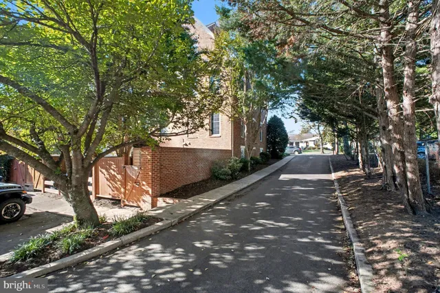 a view of a brick house with a yard