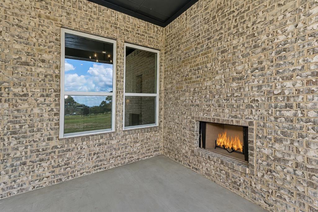 1057 Vh Ranch Poolville, TX 76487 - Photo 32 of 38 a view of an outdoor space and fire pit