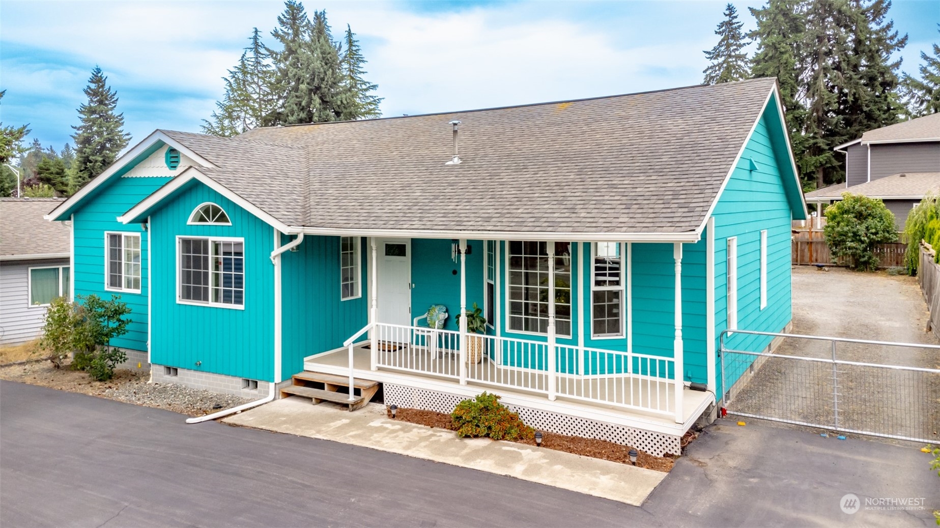 2401 Northeast 27th Street Renton, WA 98056 - Photo 1 of 24 a view of a house with a patio and a garden