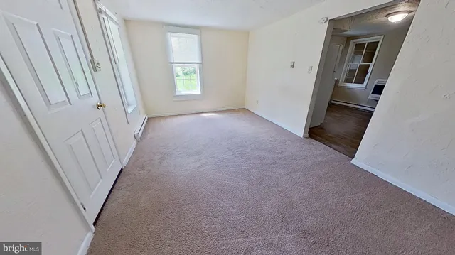 a room with window and wooden floor