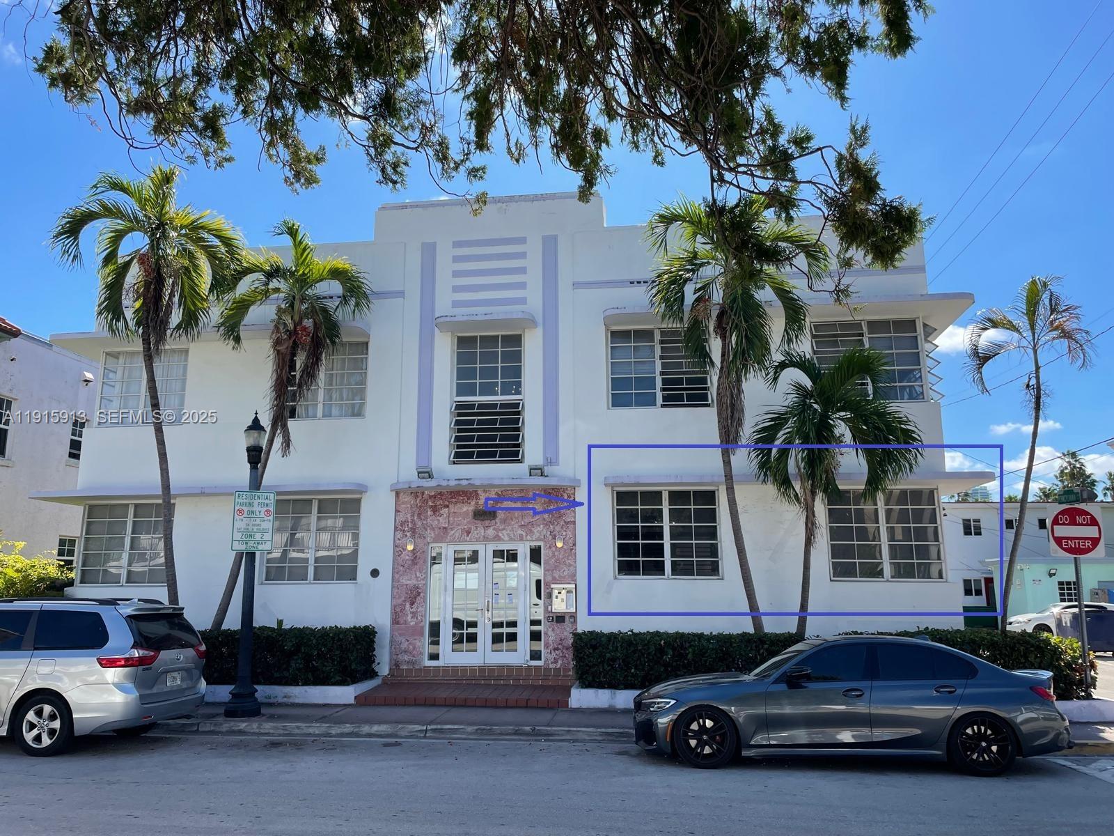610 8th Street, Unit 101 Miami Beach, FL 33139 - Photo 3 of 17 a car parked in front of a house