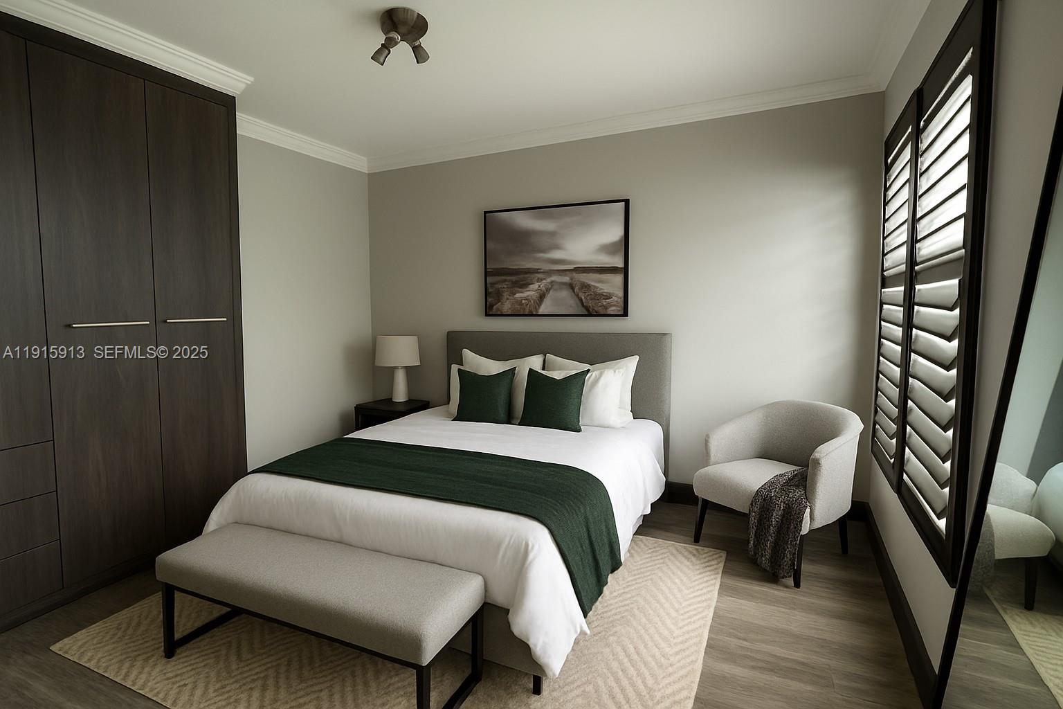 610 8th Street, Unit 101 Miami Beach, FL 33139 - Photo 10 of 17 a bedroom with furniture and wooden floor