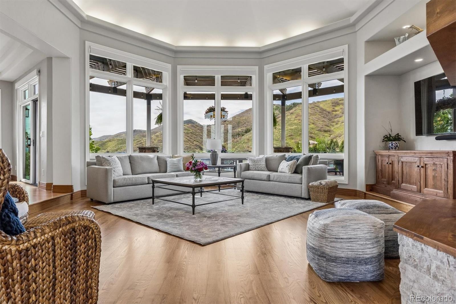 16422 Rocky Point Lane Morrison, CO 80465 - Photo 4 of 50 a living room with furniture and large windows