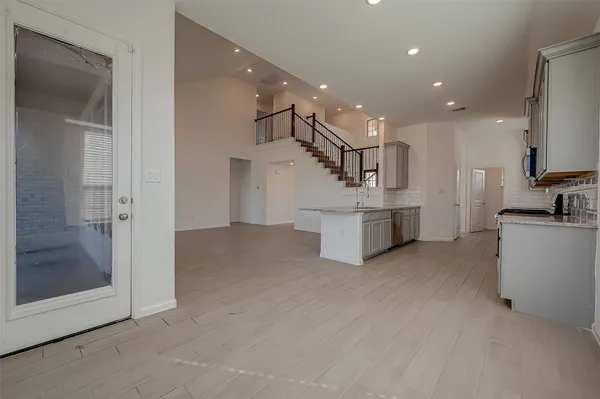 a view of an empty room with a window