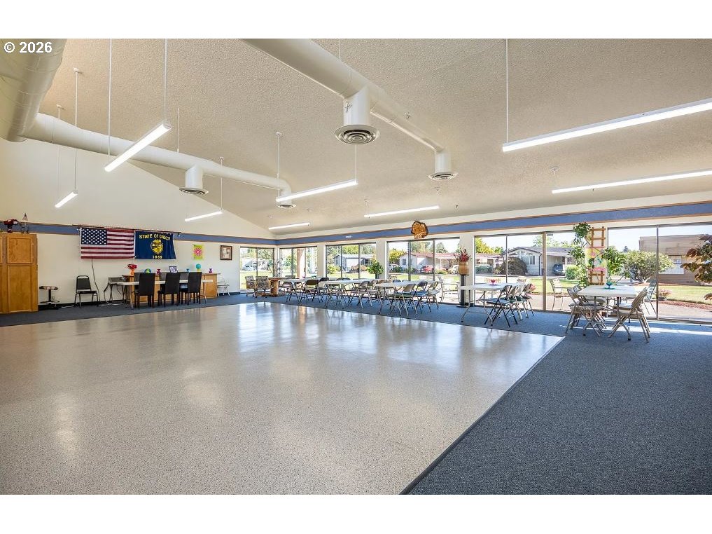 1199 North Terry Street, Unit 309 Eugene, OR 97402 - Photo 43 of 45 a view of a living room and floor to ceiling window