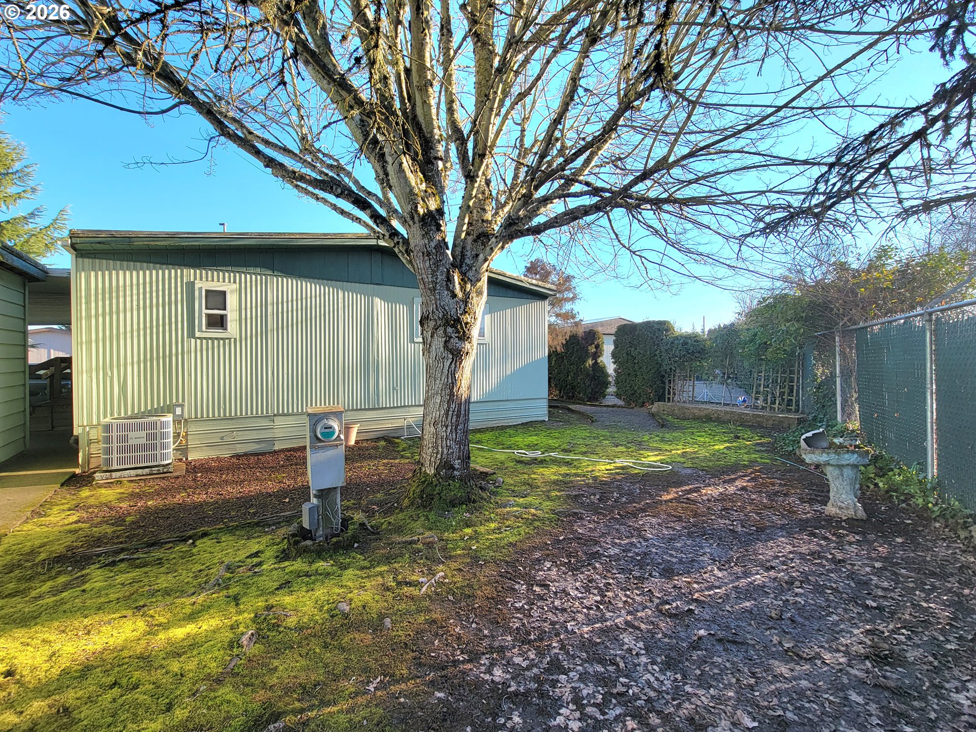 1199 North Terry Street, Unit 309 Eugene, OR 97402 - Photo 8 of 45 a backyard of a house with barbeque oven