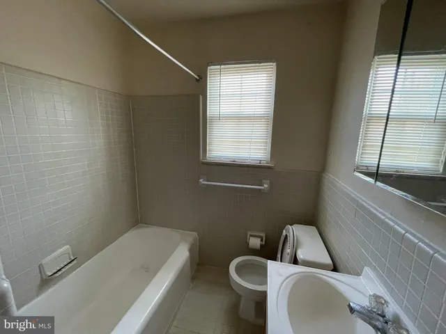 a bathroom with a sink and bathtub