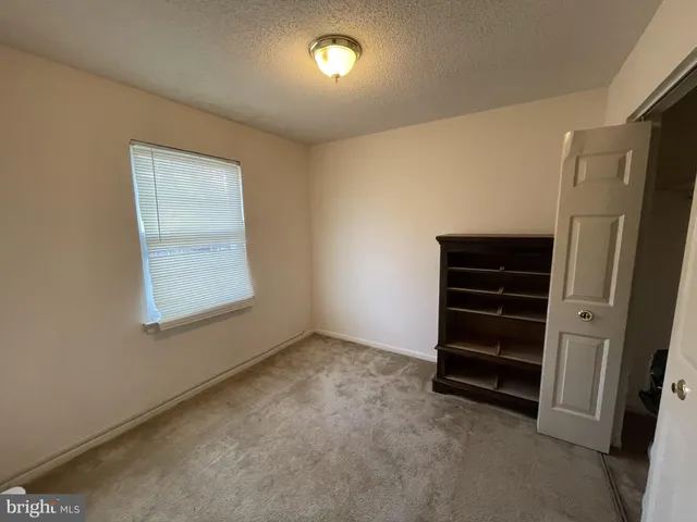 a view of room with closet and window
