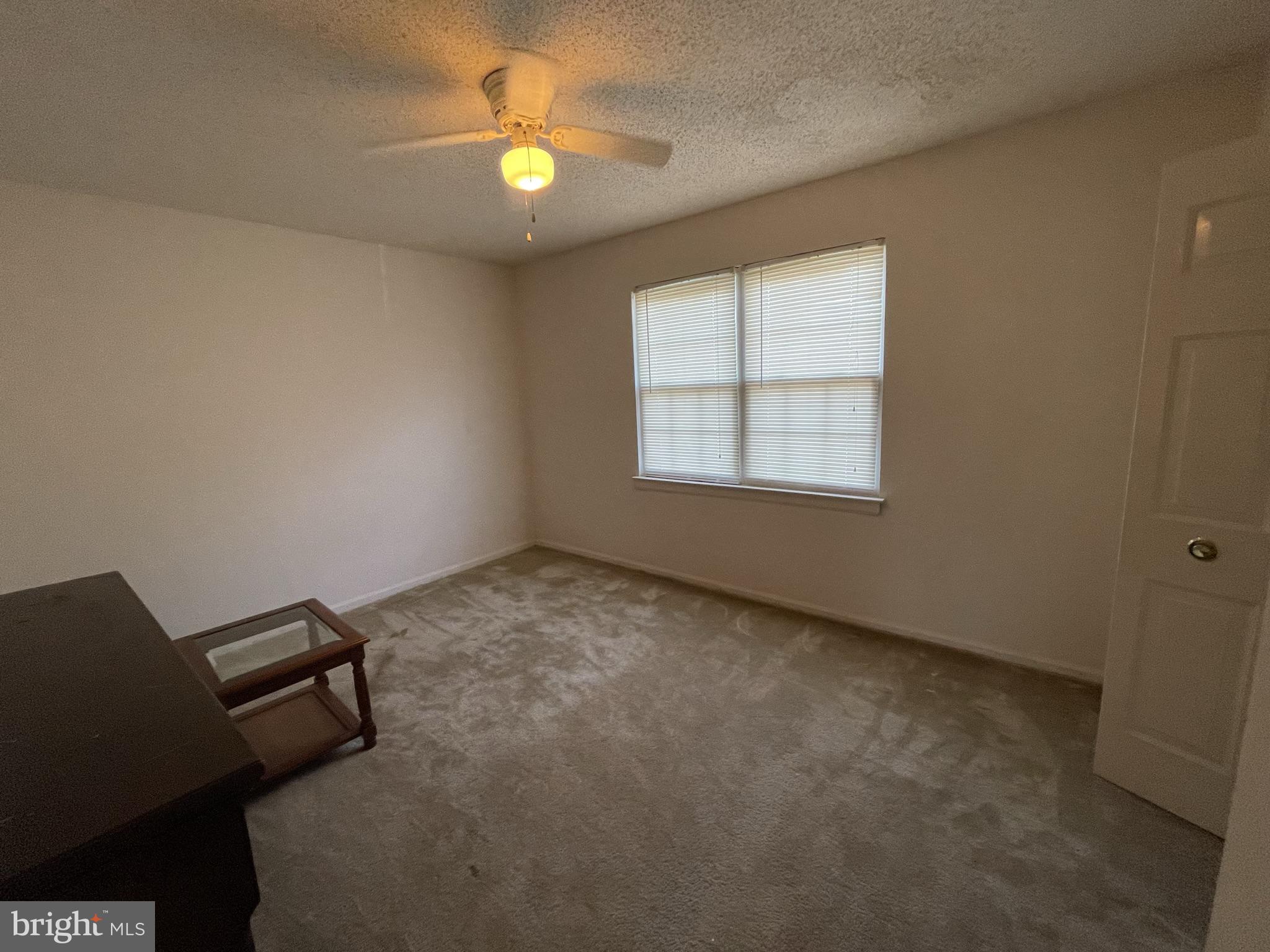 100 Park Boulevard, Unit 44D Cherry Hill, NJ 08034 - Photo 8 of 8 an empty room with windows and ceiling fan