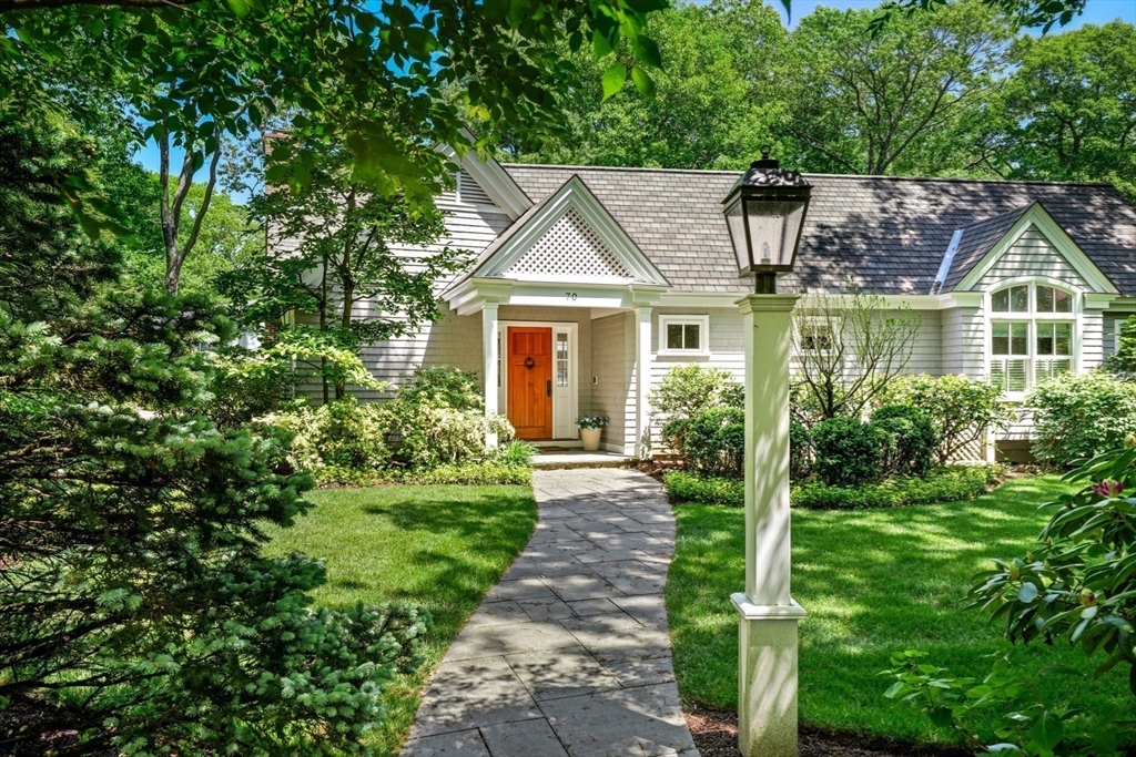 70 Old Farm Road Wellesley, MA 02481 - Photo 1 of 38 a front view of a house with a yard and potted plants
