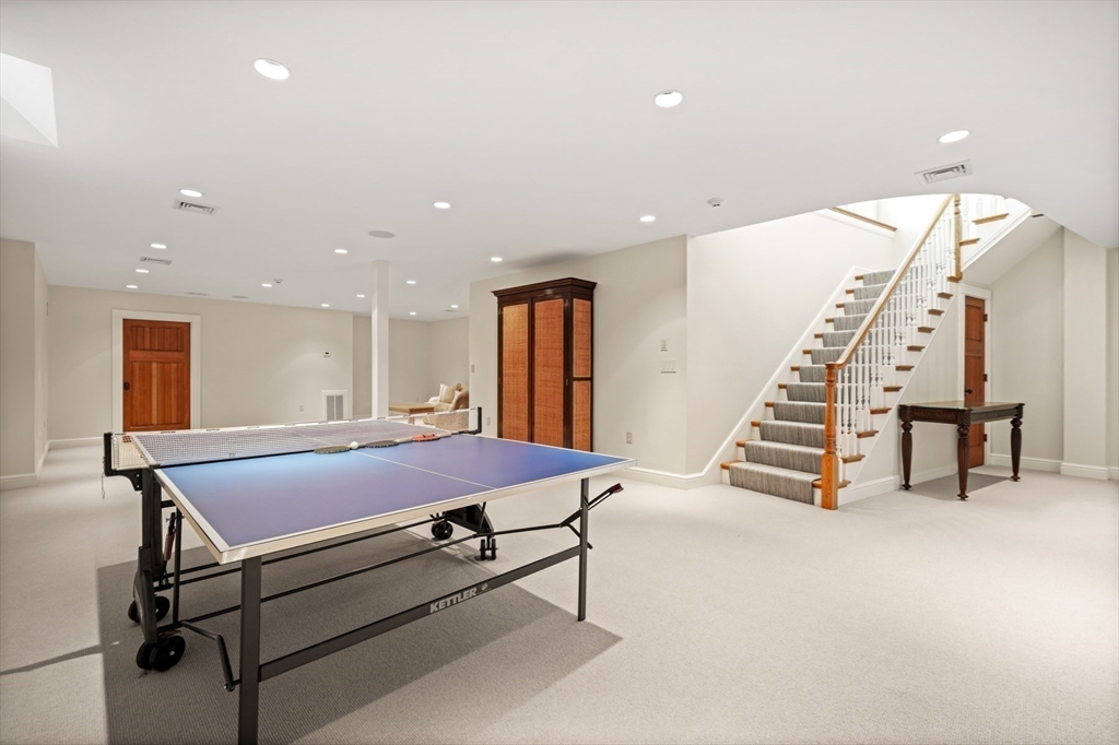 70 Old Farm Road Wellesley, MA 02481 - Photo 18 of 38 a pool with a table and chairs