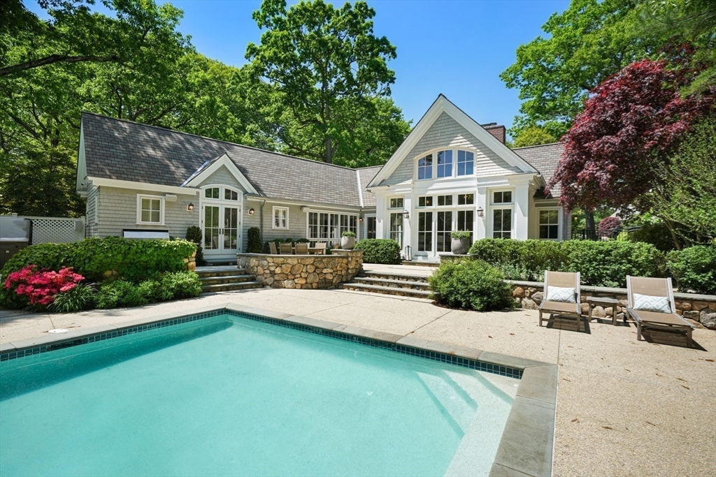70 Old Farm Road Wellesley, MA 02481 - Photo 2 of 38 a house with a garden and yard