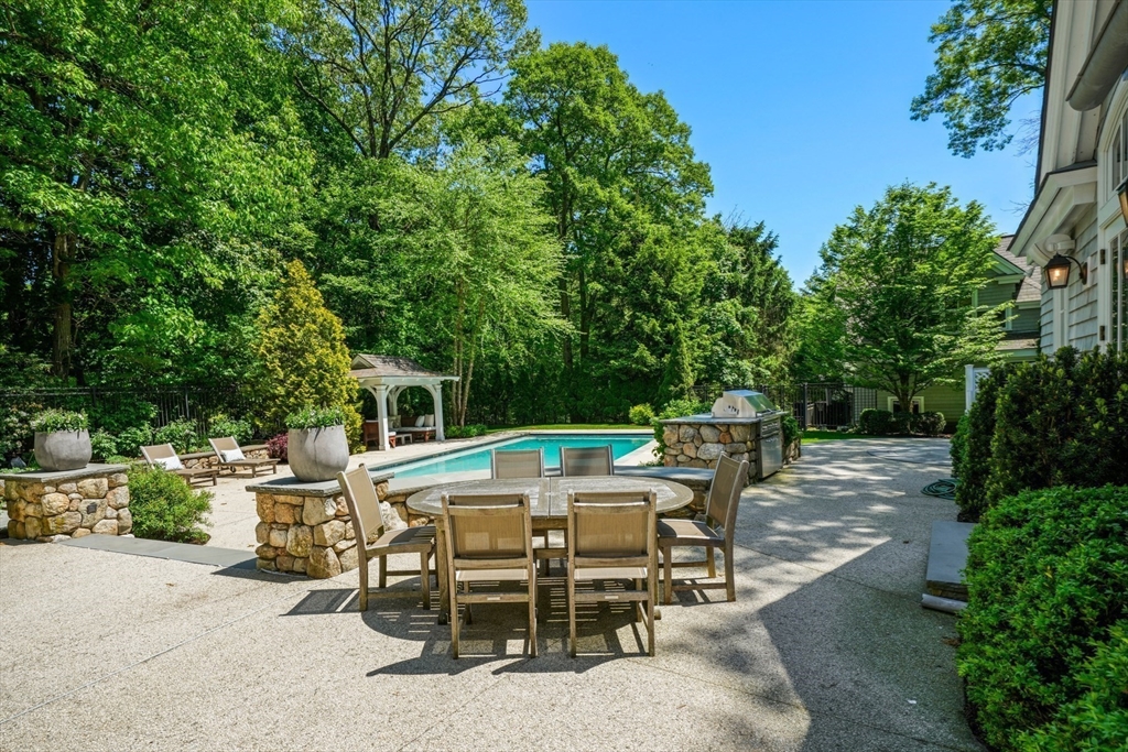 70 Old Farm Road Wellesley, MA 02481 - Photo 29 of 38 a view of a dinning table and chairs in the patio