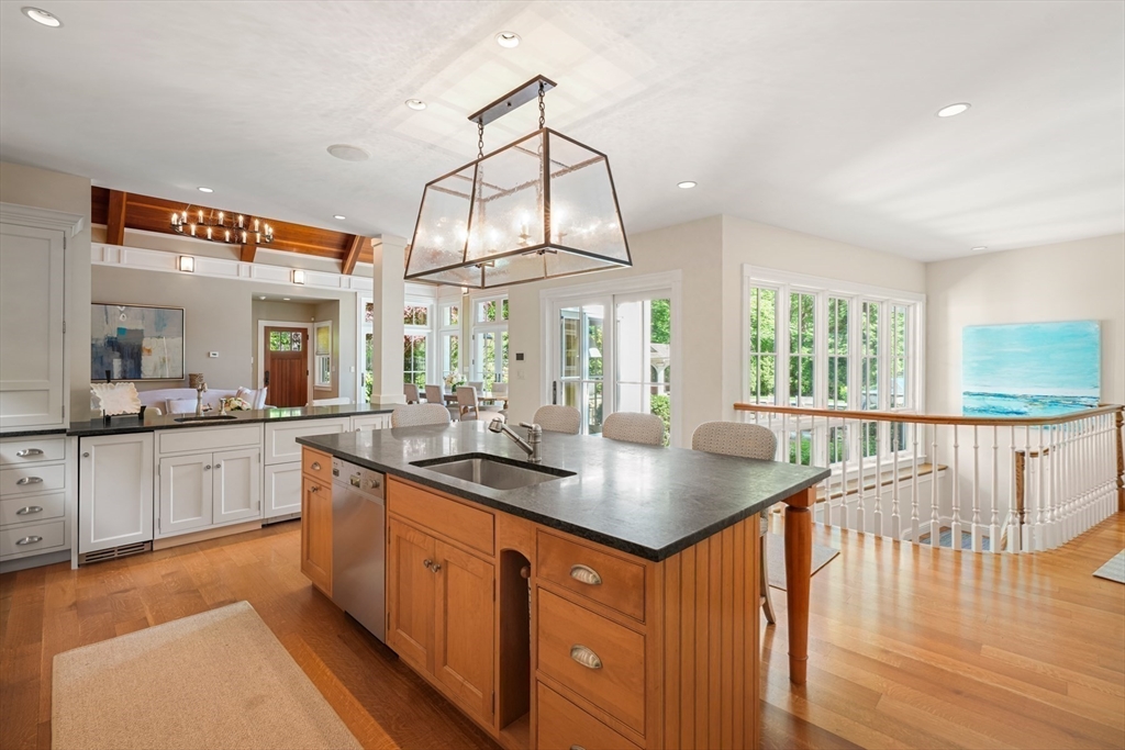 70 Old Farm Road Wellesley, MA 02481 - Photo 7 of 38 a kitchen with stainless steel appliances granite countertop a sink a stove top oven a counter space and cabinets